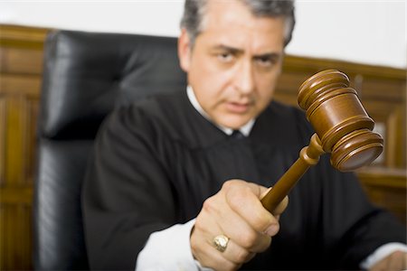 simsearch:640-01351636,k - A male judge hitting a gavel on the bench Stock Photo - Premium Royalty-Free, Code: 640-02767897