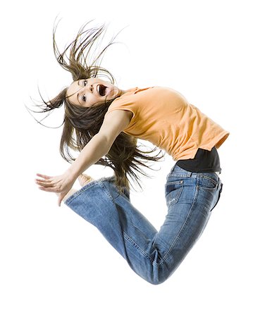 simsearch:640-03259938,k - Portrait of a teenage girl jumping Stock Photo - Premium Royalty-Free, Code: 640-02768079