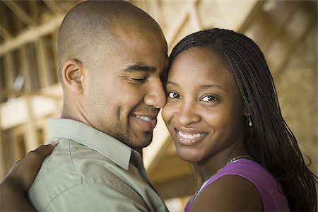 simsearch:640-02764709,k - Close-up of a young couple smiling Stock Photo - Premium Royalty-Free, Code: 640-02768133