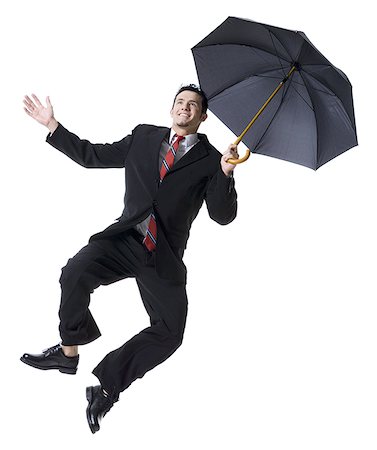 simsearch:640-01350815,k - Businessman holding an umbrella and jumping Stock Photo - Premium Royalty-Free, Code: 640-02768379