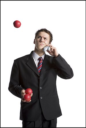 simsearch:640-03260747,k - Businessman juggling while talking on phone Stock Photo - Premium Royalty-Free, Code: 640-02768464