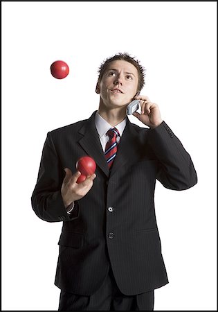 simsearch:640-03260747,k - Businessman juggling while talking on phone Stock Photo - Premium Royalty-Free, Code: 640-02768465
