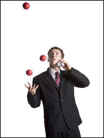 simsearch:640-03260747,k - Businessman juggling while talking on phone Stock Photo - Premium Royalty-Free, Code: 640-02768466