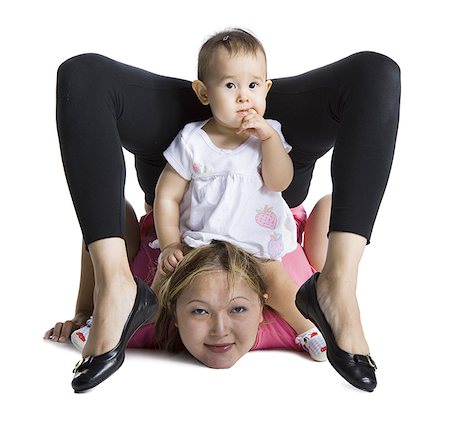 female contortionist bend over backward - Contortionist mother with baby daughter Stock Photo - Premium Royalty-Free, Code: 640-02768484