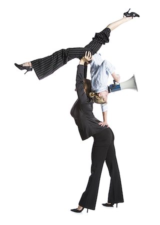Two female contortionist businesswomen Stock Photo - Premium Royalty-Free, Code: 640-02768625