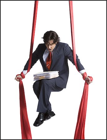 simsearch:640-01363355,k - Businessman tangled in red drapes Stock Photo - Premium Royalty-Free, Code: 640-02768657