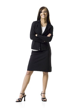 executive standing white background - Femme d'affaires permanent avec les mains sur les hanches Photographie de stock - Premium Libres de Droits, Code: 640-02768923