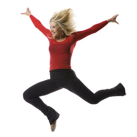 Woman jumping Stock Photo - Premium Royalty-Free, Code: 640-02769288