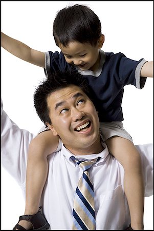 dad carrying teen son - Father and son Stock Photo - Premium Royalty-Free, Code: 640-02769421