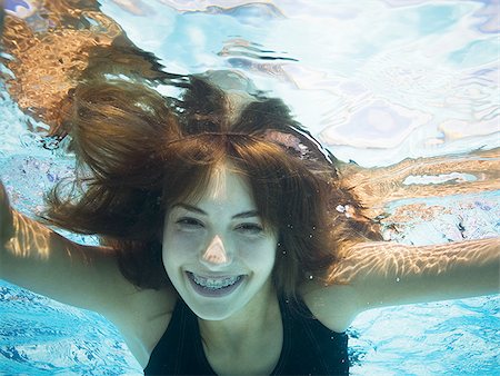 pictures 13 year old girls swimming - Girl swimming underwater in pool Stock Photo - Premium Royalty-Free, Code: 640-02769539