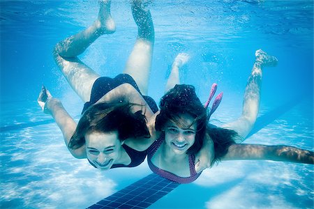 pictures 13 year old girls swimming - Girls swimming underwater in pool Stock Photo - Premium Royalty-Free, Code: 640-02769540