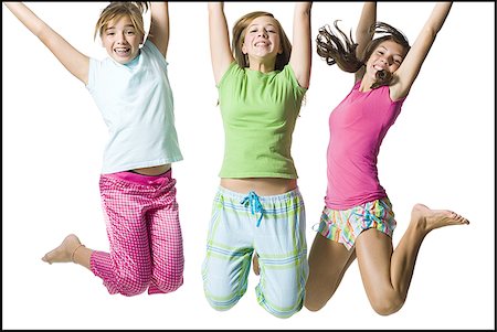 Three girls jumping Stock Photo - Premium Royalty-Free, Code: 640-02769839