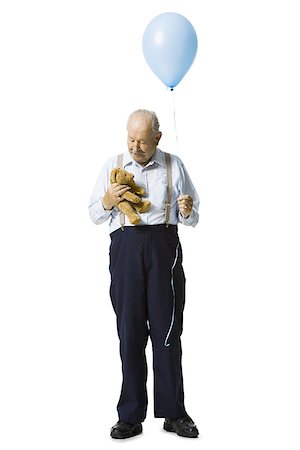 Older man holding balloon and plush toy Foto de stock - Sin royalties Premium, Código: 640-02769992