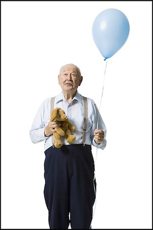 Older man holding balloon and plush toy Foto de stock - Sin royalties Premium, Código: 640-02769993