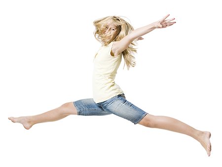 simsearch:640-01601671,k - Girl leaping and smiling with arms up Stock Photo - Premium Royalty-Free, Code: 640-02775313