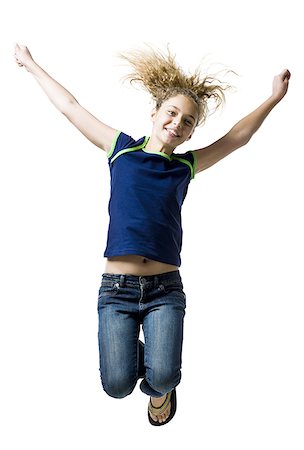 simsearch:640-03259938,k - Girl leaping and smiling with arms up Stock Photo - Premium Royalty-Free, Code: 640-02775364