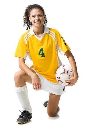 simsearch:640-03256208,k - Teenage girl holding soccer ball souriant Photographie de stock - Premium Libres de Droits, Code: 640-02775904