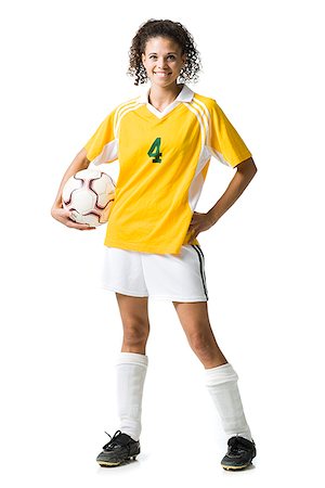 soccer player holding ball - Teenage girl holding soccer ball smiling Stock Photo - Premium Royalty-Free, Code: 640-02775902