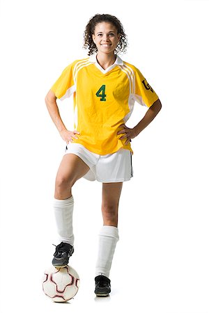 simsearch:640-03256208,k - Teenage girl holding soccer ball souriant Photographie de stock - Premium Libres de Droits, Code: 640-02775903