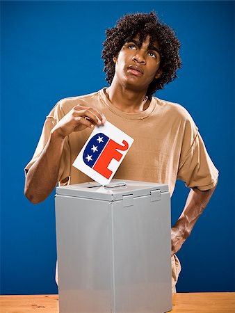 simsearch:640-02776875,k - young man in a brown shirt throwing away a political party symbol. Stock Photo - Premium Royalty-Free, Code: 640-02776899