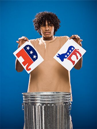 simsearch:640-02776875,k - young man in a brown shirt throwing away a political party symbol. Stock Photo - Premium Royalty-Free, Code: 640-02776901