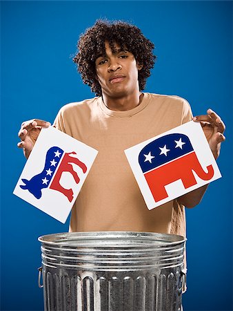 simsearch:640-02776875,k - young man in a brown shirt throwing away a political party symbol. Stock Photo - Premium Royalty-Free, Code: 640-02776903