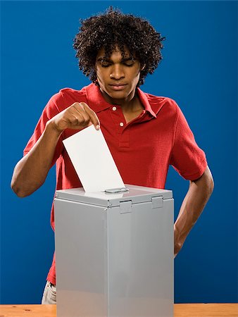 simsearch:640-02776875,k - young man casting a ballot. Stock Photo - Premium Royalty-Free, Code: 640-02776915