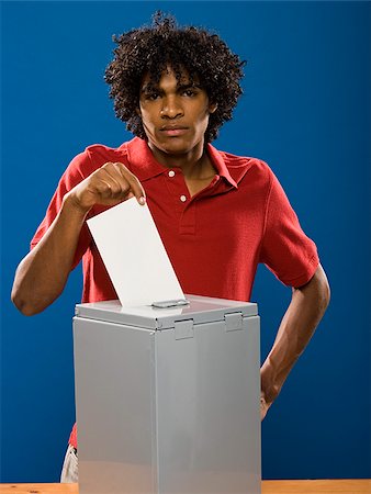 simsearch:640-02776875,k - young man casting a ballot. Stock Photo - Premium Royalty-Free, Code: 640-02776916
