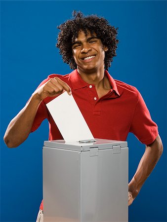 simsearch:640-02776875,k - young man casting a ballot. Stock Photo - Premium Royalty-Free, Code: 640-02776917