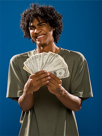 simsearch:640-02776875,k - young man holding money. Stock Photo - Premium Royalty-Free, Code: 640-02776929