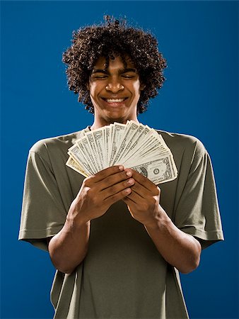 simsearch:640-02776875,k - young man holding money. Stock Photo - Premium Royalty-Free, Code: 640-02776930