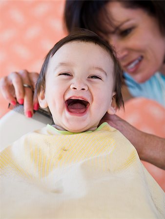 Baby getting a haircut. Stock Photo - Premium Royalty-Free, Code: 640-02777383