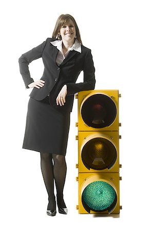businessperson holding a traffic signal Stock Photo - Premium Royalty-Free, Code: 640-02778446