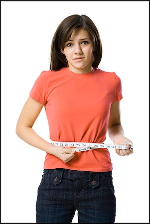 young woman with a measuring tape Stock Photo - Premium Royalty-Free, Code: 640-02778533