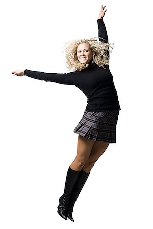 plaid skirt - woman with curly hair Stock Photo - Premium Royalty-Free, Code: 640-02779258