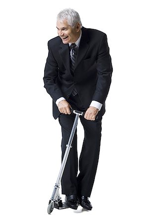 scooter with white background - Businessman on a scooter Stock Photo - Premium Royalty-Free, Code: 640-02770114