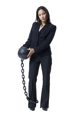 shackle - Businesswoman shackled to ball and chain Stock Photo - Premium Royalty-Free, Code: 640-02770331