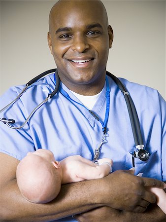 doctor and newborn baby - Male nurse or doctor holding newborn baby Stock Photo - Premium Royalty-Free, Code: 640-02771739