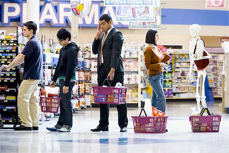 skeleton woman - Four people and a skeleton in grocery store lineup Stock Photo - Premium Royalty-Free, Code: 640-02772276