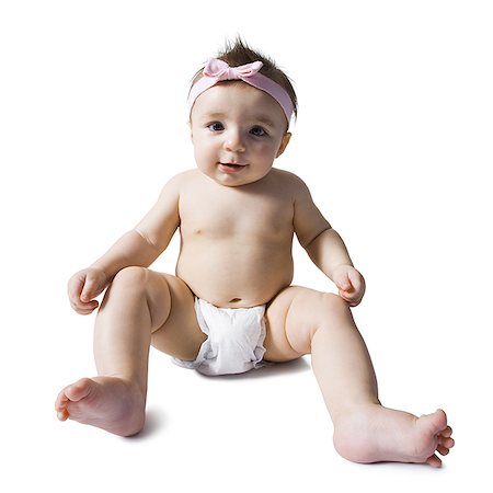 Baby girl sitting in diaper Stock Photo - Premium Royalty-Free, Code: 640-02772277