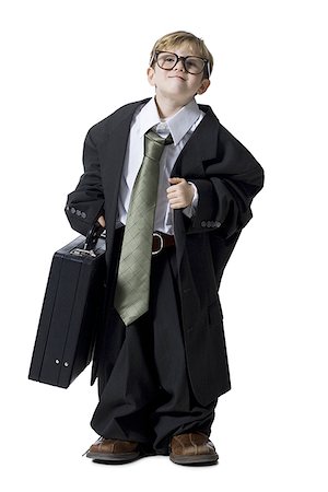 small business portrait full body - Little boy dressed as business executive Stock Photo - Premium Royalty-Free, Code: 640-02772517