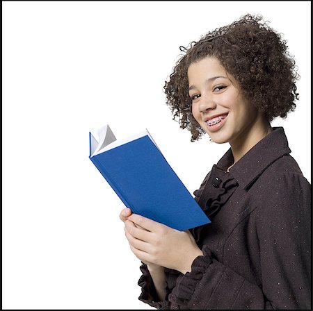simsearch:640-02773530,k - Girl with hardcover book and braces smiling Stock Photo - Premium Royalty-Free, Code: 640-02772646