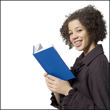 simsearch:640-02773530,k - Girl with hardcover book and braces smiling Stock Photo - Premium Royalty-Free, Code: 640-02772647