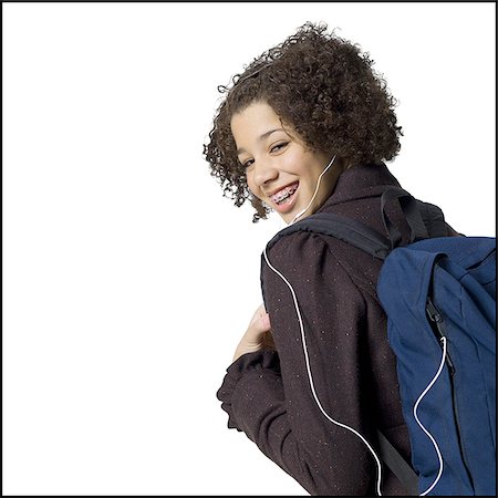 simsearch:640-02773530,k - Girl with backpack and earbuds smiling with braces Stock Photo - Premium Royalty-Free, Code: 640-02772648
