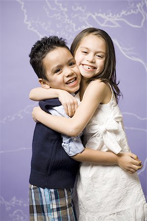 sister brother hugging two - Young girl and boy hugging Stock Photo - Premium Royalty-Free, Code: 640-02772711