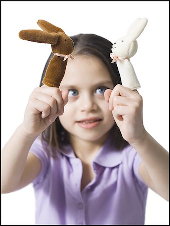 Girl with finger puppets Stock Photo - Premium Royalty-Free, Code: 640-02772729