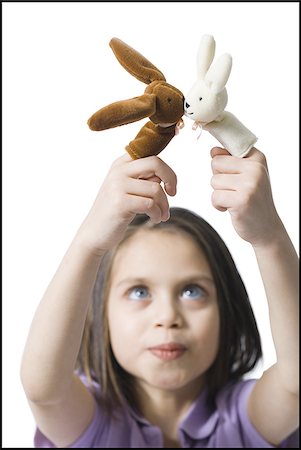 Girl with finger puppets Stock Photo - Premium Royalty-Free, Code: 640-02772730