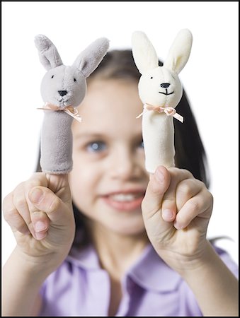 Girl with finger puppets Stock Photo - Premium Royalty-Free, Code: 640-02772732