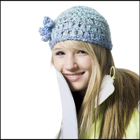 simsearch:640-02773530,k - Girl with winter hat and skis smiling Stock Photo - Premium Royalty-Free, Code: 640-02772914