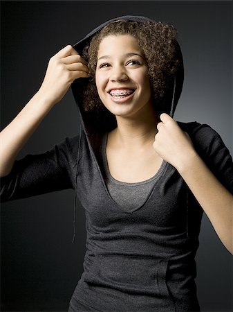 simsearch:640-02773530,k - Girl with braces smiling Stock Photo - Premium Royalty-Free, Code: 640-02772976
